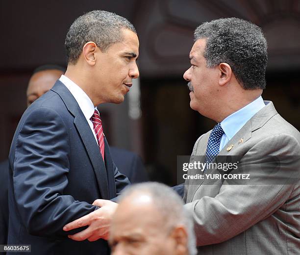 President Barack Obama says good bye to Dominican Republic's President Leonel Fernandez before the family photo at the Diplomatic Center at the end...