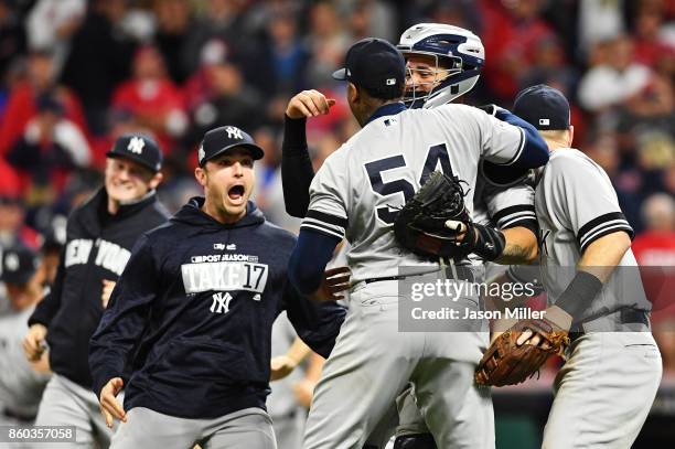 Aroldis Chapman of the New York Yankees celebrates with teammates after their 5 to 2 win over the Cleveland Indians in Game Five of the American...