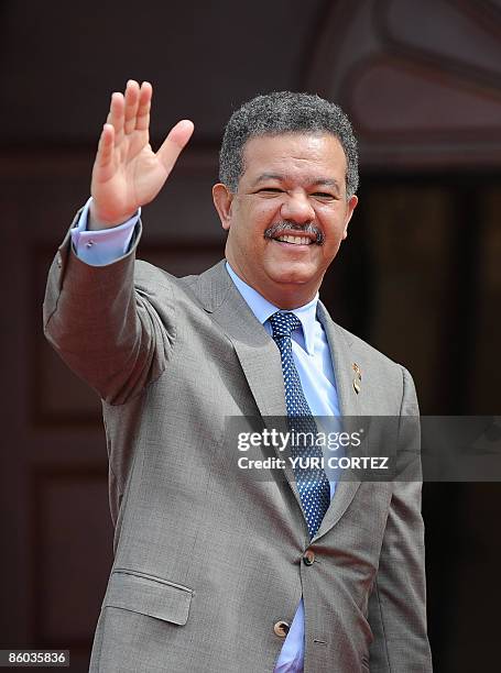 The President of the Dominican Republic, Leonel Fernandez, waves as he arrives for a retreat for heads of state at the Diplomatic Centre during the...