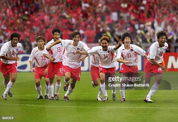 South Korea celebrate victory after the FIFA World Cup Finals 2002 Quarter Finals match between Spain and South Korea played at the Gwangju World Cup...