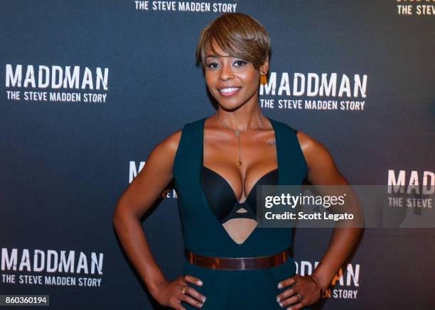 Actress Erica Peeples poses on red carpet during movie premiere at the Michigan Theater on October 11, 2017 in Ann Arbor, Michigan.