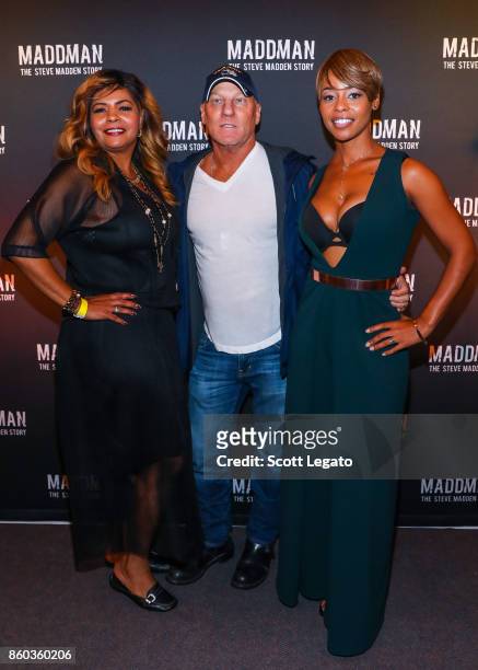AnnDera Peeples, shoe designer Steve Madden and Actress Erica Peeples pose on red carpet during movie premiere at the Michigan Theater on October 11,...
