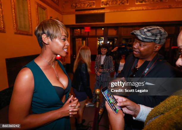 Actress Erica Peeples gets interviewed on red carpet during movie premiere at the Michigan Theater on October 11, 2017 in Ann Arbor, Michigan.