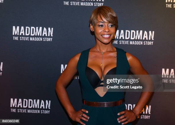 Actress Erica Peeples poses on red carpet during movie premiere at the Michigan Theater on October 11, 2017 in Ann Arbor, Michigan.