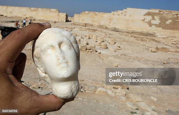 An alabaster statue of Cleopatra is shown to the press at the temple of Tasposiris Magna near Borg al-Arab, 50 kms west of Alexandria, on April 19,...