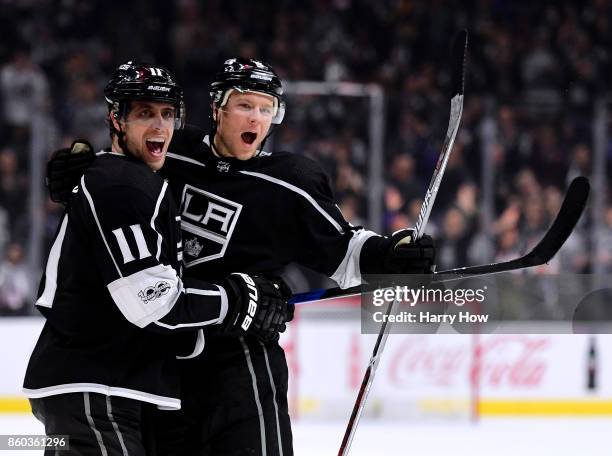 Anze Kopitar of the Los Angeles Kings celebrates his goal with Christian Folin to trail 2-1 to the Calgary Flames during the second period at Staples...