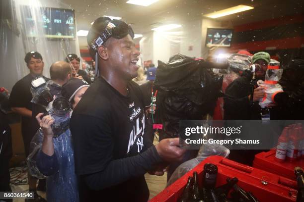 Didi Gregorius of the New York Yankees celebrates in the locker room after their 5 to 2 win over the Cleveland Indians in Game Five of the American...