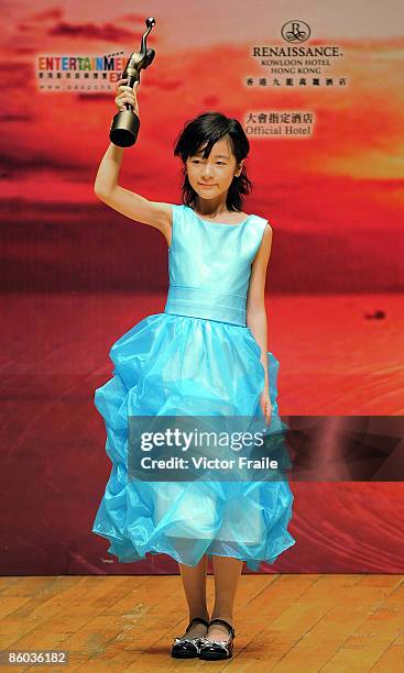 Chinese actress Xu Jiao poses backstage after winning the Best New Performer award for her role in the movie "CJ7" during the 28th Hong Kong Film...