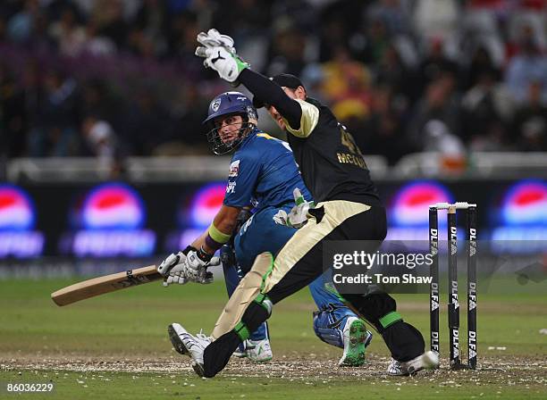 Herschelle Gibbs of Deccan Chargers hits out at Brendon McCullum of Kolkata looks on during the IPL T20 match between Deccan Chargers and Kolkata...