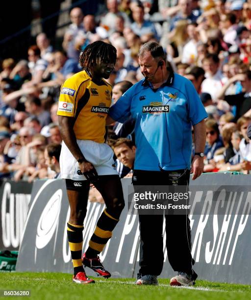Wasps winger Paul Sackey is helped off the pitch after suffering an injury during the Guinness Premiership match between Bristol and Wasps at The...