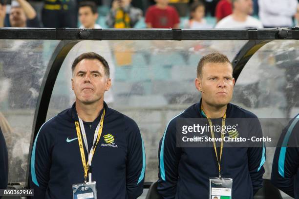 Ante Milicic and Josep Gombau of Australia stand for the National Anthem during the 2018 FIFA World Cup Asian Playoff match between the Australian...