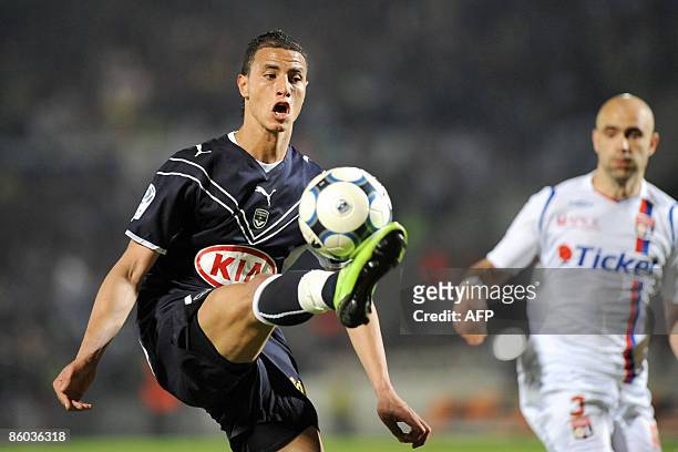 Bordeaux' forward Marouane Chamakh vies with Lyon's defender Cris during their French L1 football match Bordeaux vs. Lyon at Chaban Delmas Stadium in...