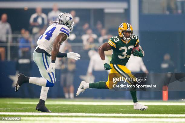 Green Bay Packers running back Aaron Jones is chased by Dallas Cowboys outside linebacker Jaylon Smith during the football game between the Green Bay...