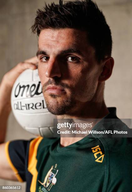 Scott Pendlebury poses for a photograph during the Australian International Rules Series Team Announcement at AFL House on October 12, 2017 in...