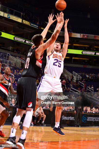 Alec Peters of the Phoenix Suns shoots the ball against the Portland Trail Blazers during the preseason game on October 11, 2017 at Talking Stick...