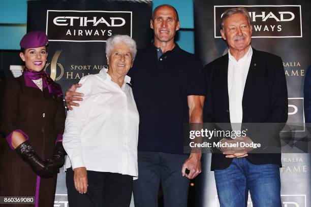 Sport Australia Hall of Fame Inductee and legend AFL footballer Tony Lockett poses with sporting legends Dawn Fraser and John Bertrand at the...