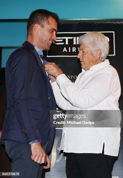 Sport Australia Hall of Fame Inductee and legend Cyclist Brad McGee gets his pin presented by sporting legend Dawn Fraser at the National Sport...
