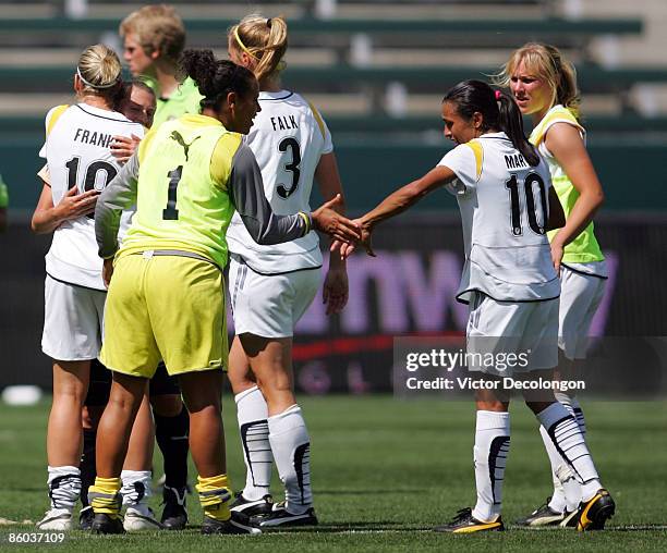 Back-up goalkeeper Val Henderson of the Los Angeles Sol congratulates teammate Marta Vieira da Silva after their 1-0 win over FC Gold Pride in their...