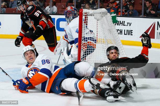 Andrew Cogliano of the Anaheim Ducks gets tangled up with Nikolay Kulemin of the New York Islanders during the game on October 11, 2017 at Honda...