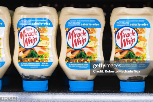 Kraft Miracle Whip on a store shelf, salad dressing bottles placed upside down in a row.