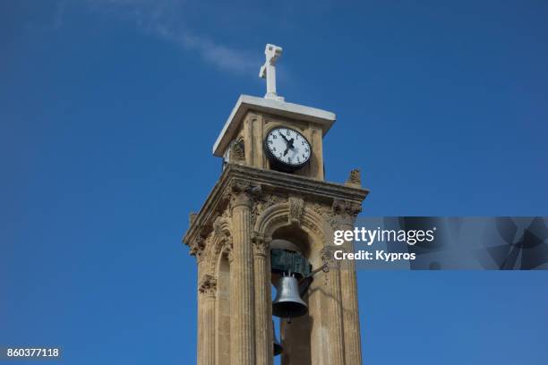 2017 - europe, greece, cyprus, troodos, gerakies village, view of church cross bell tower clock tower - agios georgios greek orthodox church - agios georgios church stock-fotos und bilder