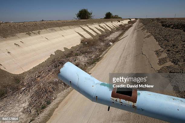 An irrigation canal is left dry on April 19, 2009 near Tranquility, California. Central Valley farmers and farm workers are suffering through the...