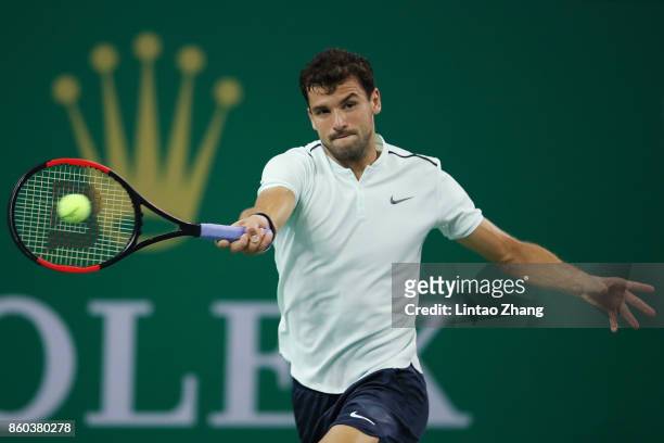 Grigor Dimitrov of Bulgaria returns a shot during the Men's singles mach third round against Sam Querrey of the United States on day five of 2017 ATP...