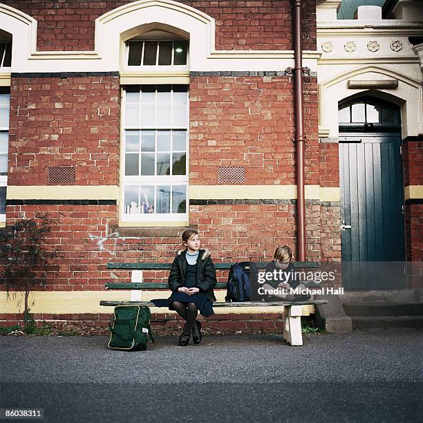 school children in schoolyard - melbourne school stock pictures, royalty-free photos & images