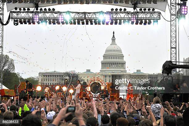 Musicians Michael Ivins, Kliph Scurlock, Wayne Coyne, and Steven Drozd of the Flaming Lips perform during Earth Day 2009 on the National Mall on...