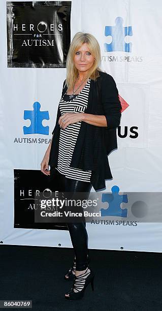 Actress Michelle Collins attends the "Heroes For Autism" charity auction and concert benefitting Austism Speaks on April 19, 2009 in Los Angeles,...