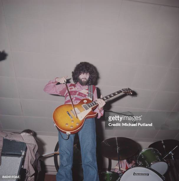 English guitarist and songwriter Jimmy Page of English rock group Led Zeppelin playing his Gibson Les Paul guitar with a violin bow, UK, 1969.