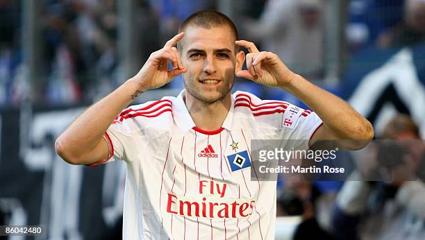 Mladen Petric of Hamburg celebrates after scoring his team's second goal during during the Bundesliga match between Hamburger SV and Hannover 96 at...