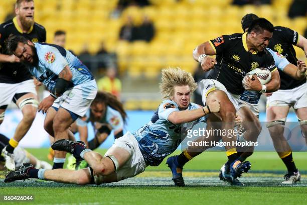 Asafo Aumua of Wellington is tackled by Josh Goodhue of Northland during the round nine Mitre 10 Cup match between Wellington and Northland at...