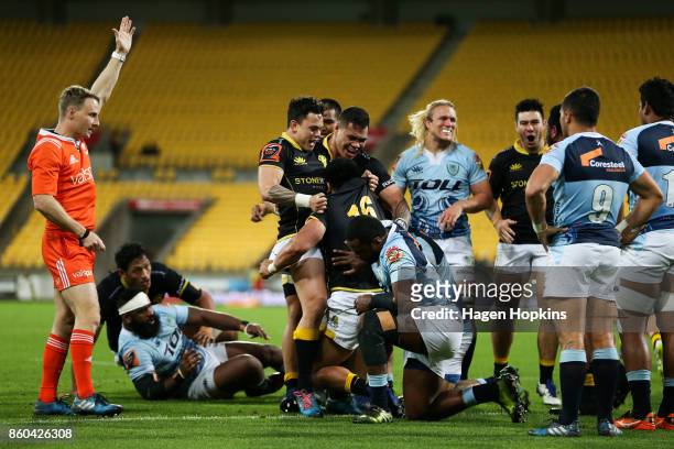 Asafo Aumua of Wellington celebrates with Carlos Price and Alex Fidow after scoring a try during the round nine Mitre 10 Cup match between Wellington...