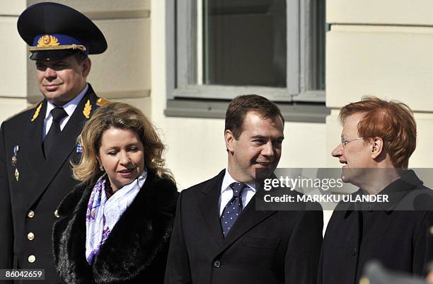 Russian President Dmitry Medvedev and his Svetlana talk with Finnish President Tarja Halonen during the official welcoming ceremony in front of the...