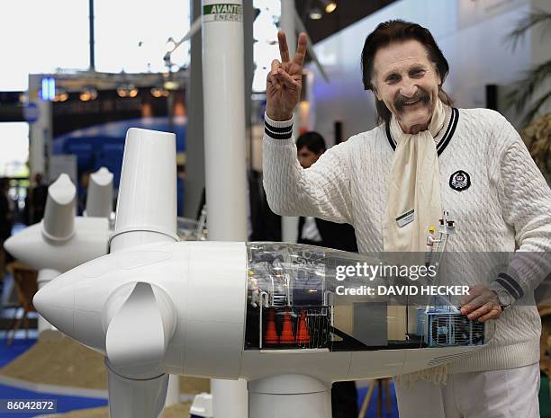 German designer Luigi Colani poses behind the model of a windmill he designed for Avantis-Energgy at the Hannover Messe fair for industrial...