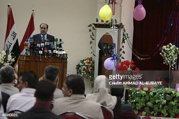Iraqi Prime Minister Nuri al-Maliki addresses the children and spouses of Iraqis killed during the regime of former Iraqi president Saddam Hussein in...