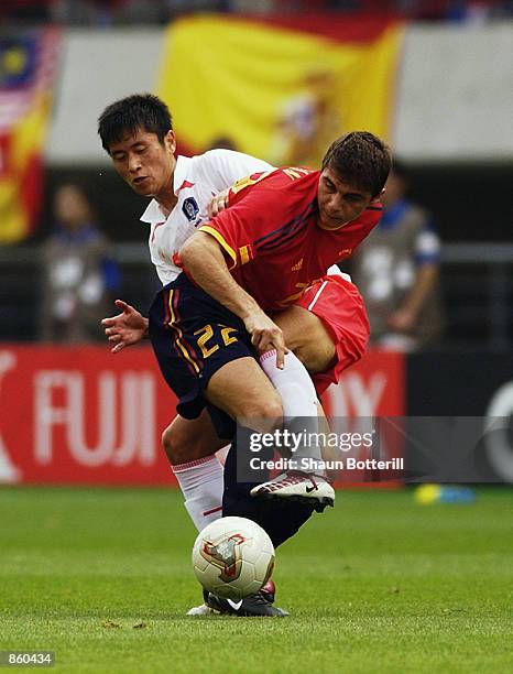 Joaquin of Spain shields the ball from Young Pyo Lee of South Korea during the FIFA World Cup Finals 2002 Quarter Finals match played at the Gwangju...