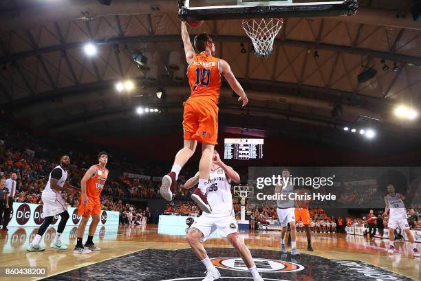 Mitch McCarron of the Taipans dunks during the round two NBL match between the Cairns Taipans and the Adelaide 36ers at Cairns Convention Centre on...