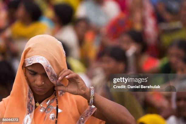 Supporters of Mayawati Kumari, Bahujan Samaj Party President and Chief Minister of Uttar Pradesh state, wait during a political rally on April 6,...