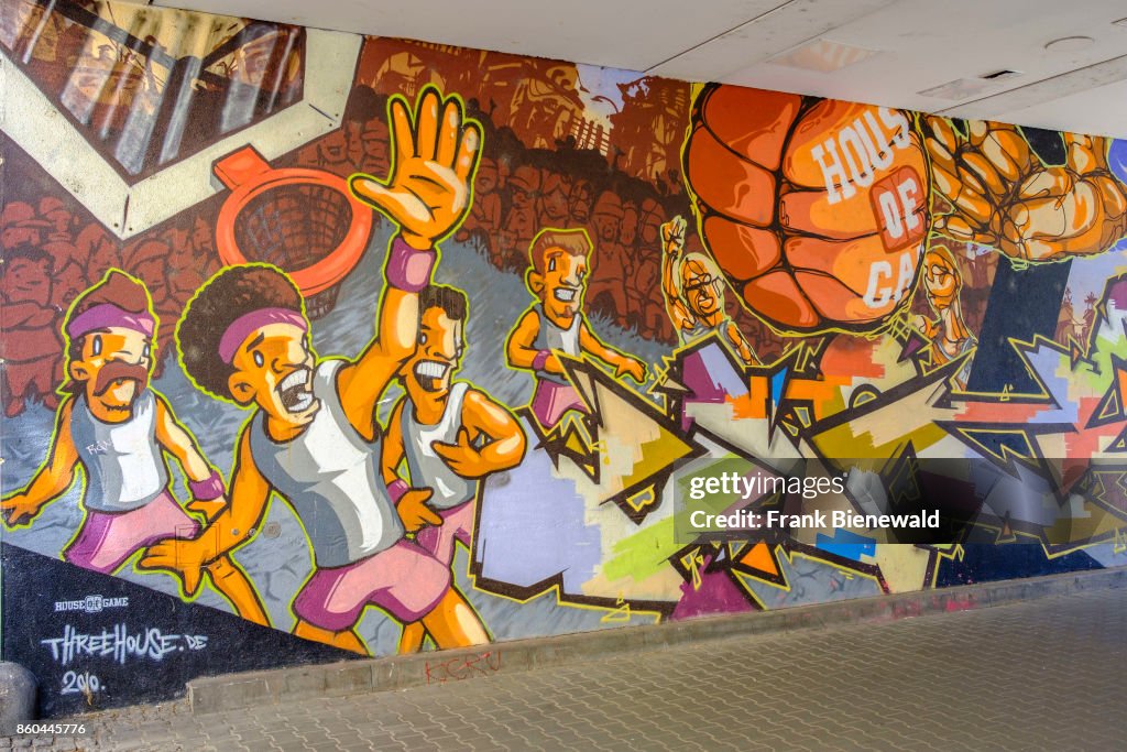 Colorful graffiti is sprayed at a house wall in the township...