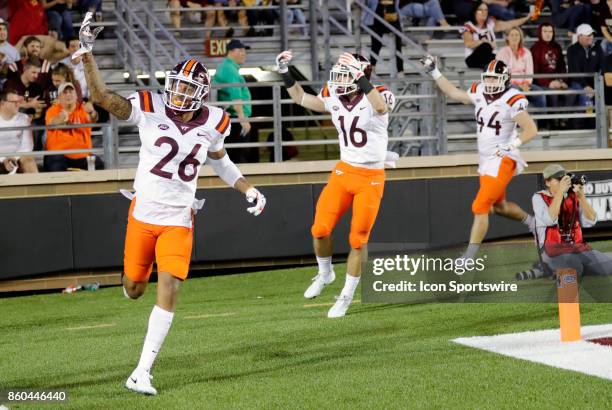 Virginia Tech defensive back Jovonn Quillen Virginia Tech running back Coleman Fox and Boston College defensive lineman Brandon Barlow celebrate a...