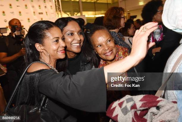 Minister Christiane Taubira poses with fans for a selfie during the "Afro" Rokhaya Diallo and photographer Brigitte Sombie Exhibition at Maison des...