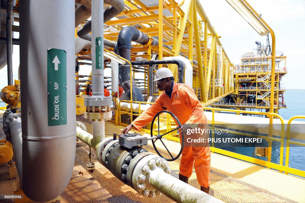 A worker inspect facilities on an upstre