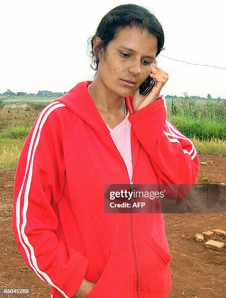 Benigna Leguizamon, the mother of Lucas Fernando Leguizamon , a second alleged son of Paraguay's President Fernando Lugo, speaks on a mobile phone in...