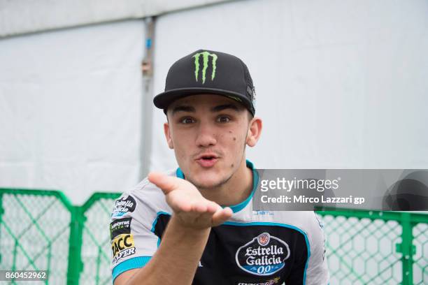 Aron Canet of Spain and Estrella Galicia 0,0 smiles in the paddock before the press conference ahead of the MotoGP of Japan at Twin Ring Motegi on...