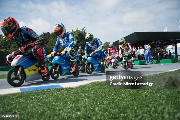 Esteve Rabat of Spain and Team EG 0,0 Marc VDS leads the field and rides the mini-bike during the pre-event "The mini-battle between the MotoGP...