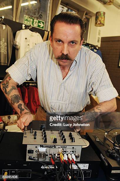 Andrew Weatherall posed behind decks at Rough Trade East record shop on April 18, 2009 in London, England.
