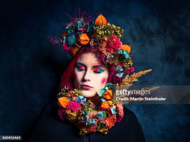 girl with closed eyes and colorful flower styling - creative director stock pictures, royalty-free photos & images