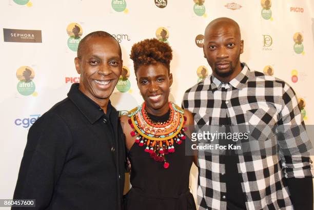 Singer Claudy Siar, Rokhaya Diallo and Singuila attend the "Afro" Rokhaya Diallo and photographer Brigitte Sombie Exhibition at Maison des Metallos...